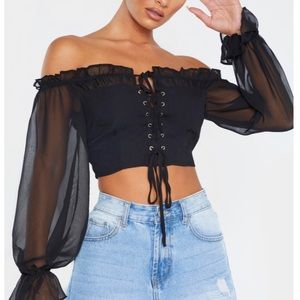 Black crop top shirt. Fits true to size , Xs-0.